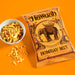 Howdah Bombay Mix snack package with a bowl of snacks on an orange background
