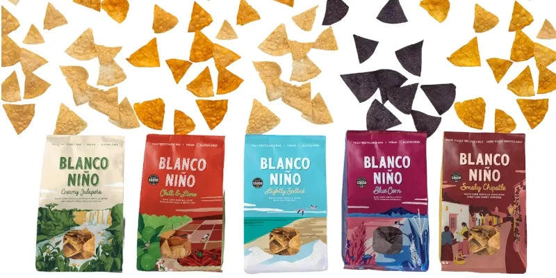 Blanco Nino Tortilla Chips All 5 flavours in a line with loose crisps above the top of the bags
