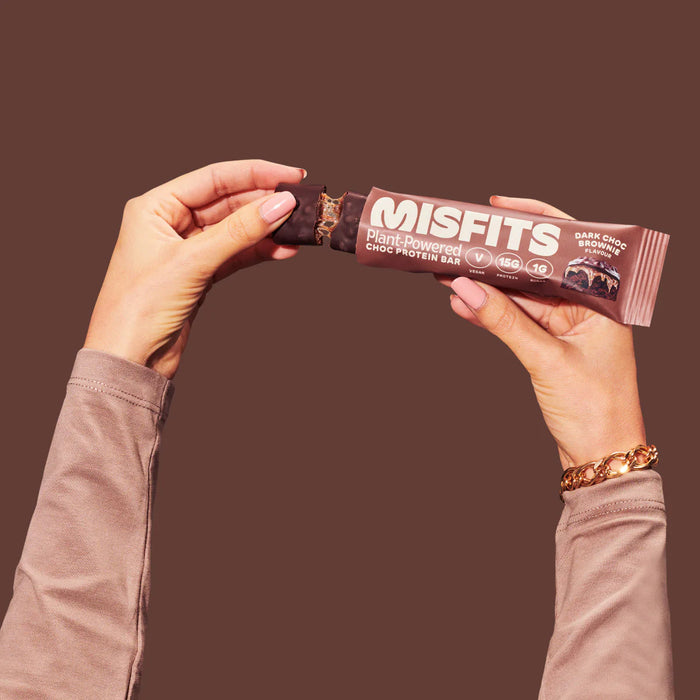 Misfits -  Vegan Protein Bar Dark Chocolate Brownie 45g held in 2 hands