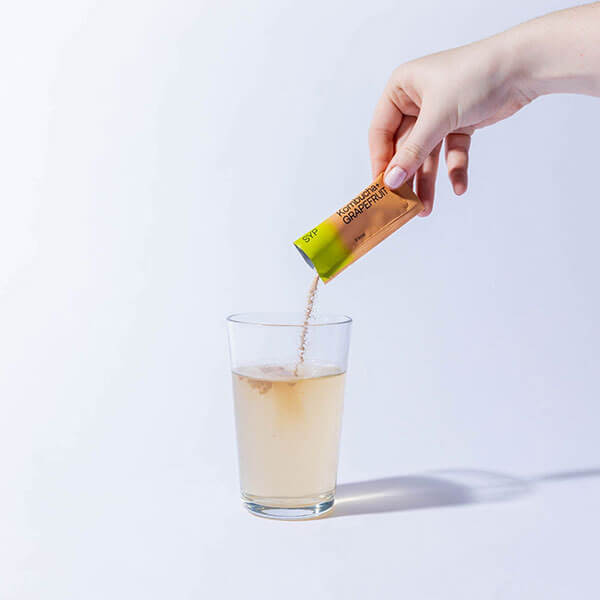 Shake Your Plants sachet added to glass of water