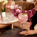 Wholesale London Essence - Pomelo & Pink Pepper Tonic Water 200ml Lifestyle Shot. Tonic water being poured into a glass with ice.