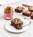 Wholesale Nut Blend - Cacao, Cashew & Almond Butter 6 x 200g plus a brownie made using the nut butter on a plate with a spoon.