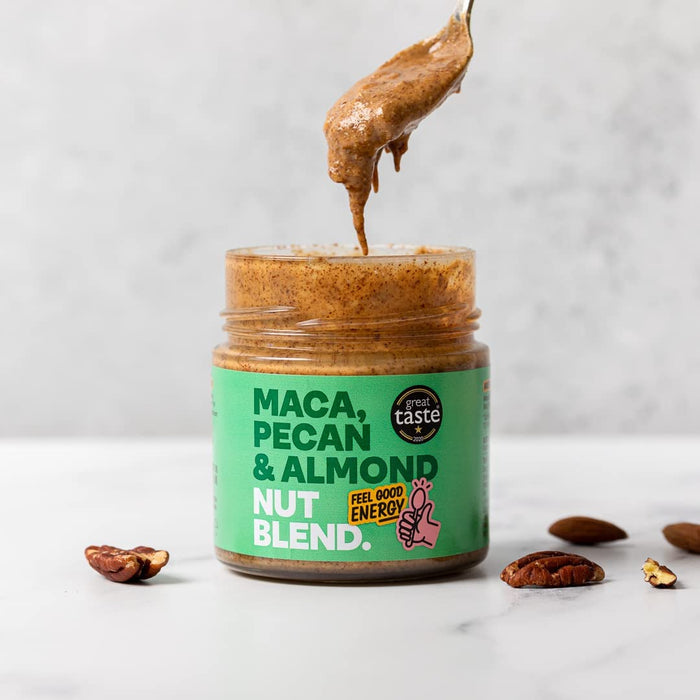 Wholesale Nut Blend - Maca, Pecan & Almond Butter 6 x 200g. Spoonful of butter is being lifted from an open jar
